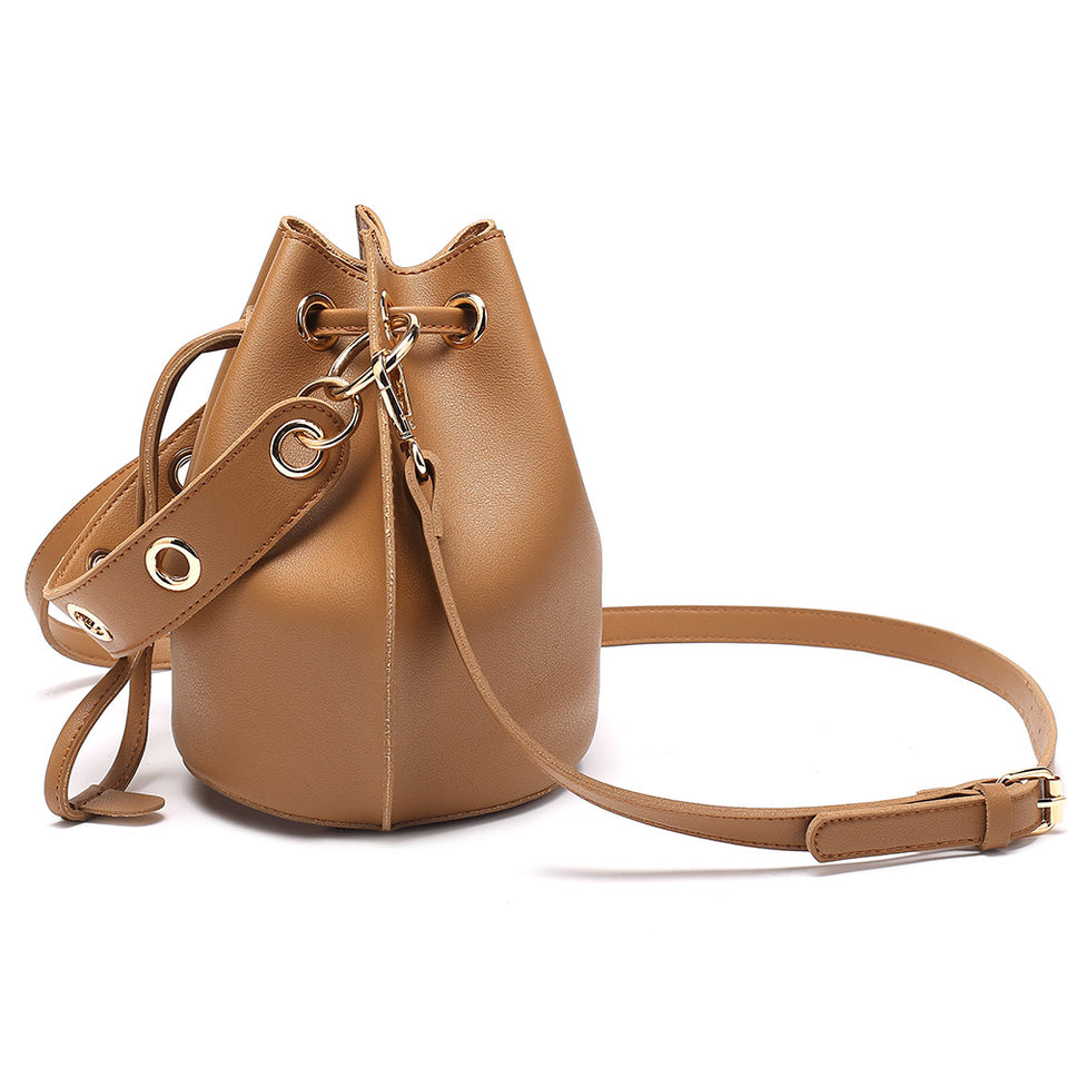 Eyelet drawstring faux leather bucket bag in Brown
