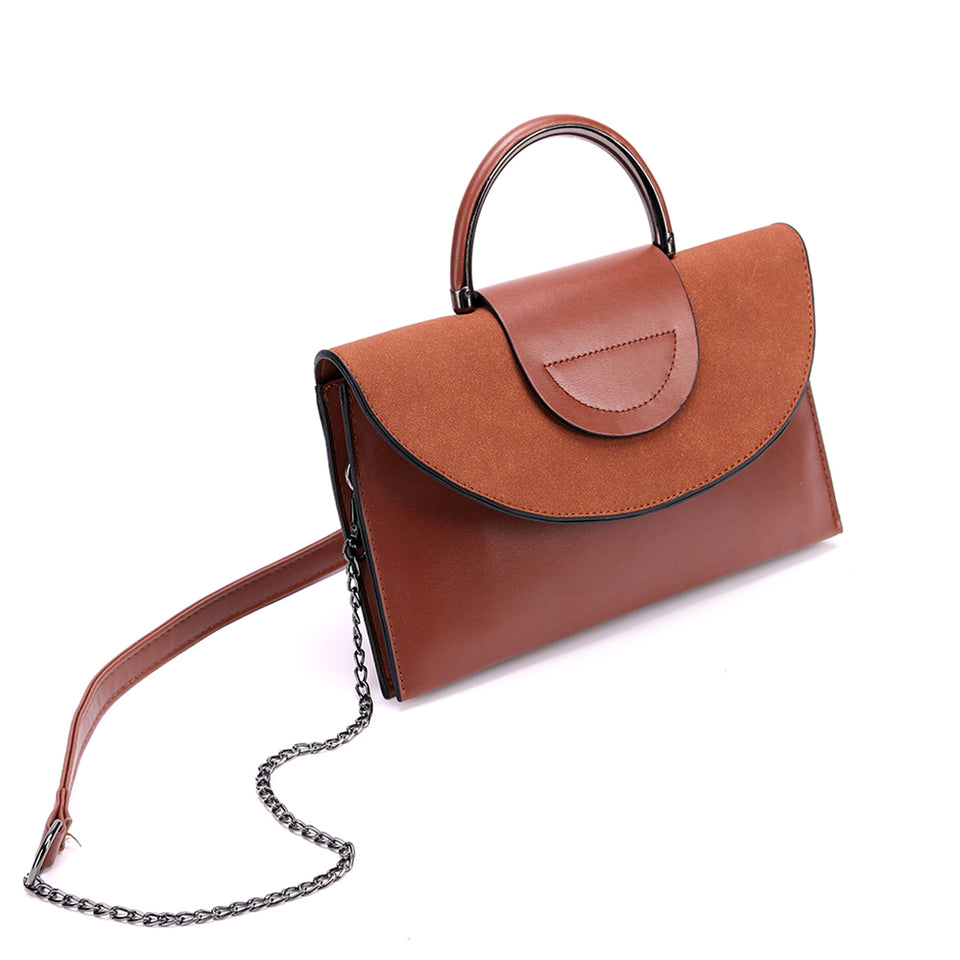 Layered flap faux leather crossbody clutch in Brown