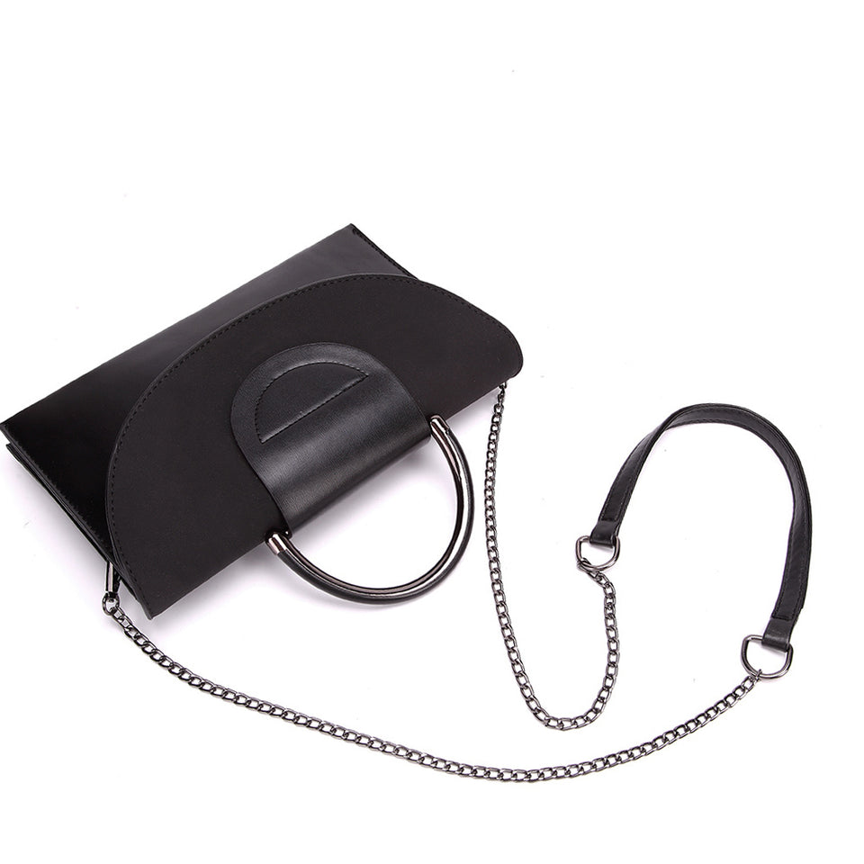Layered flap faux leather crossbody clutch in Black