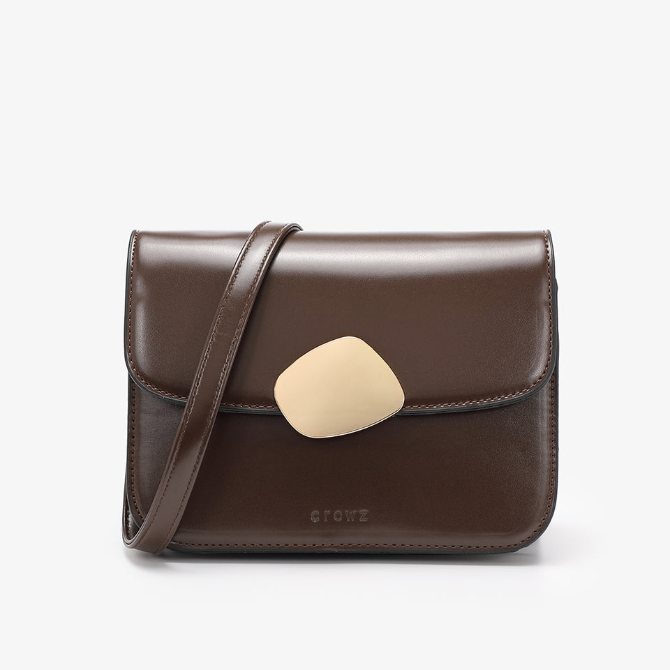Abstract hardware flap crossbody bag in brown